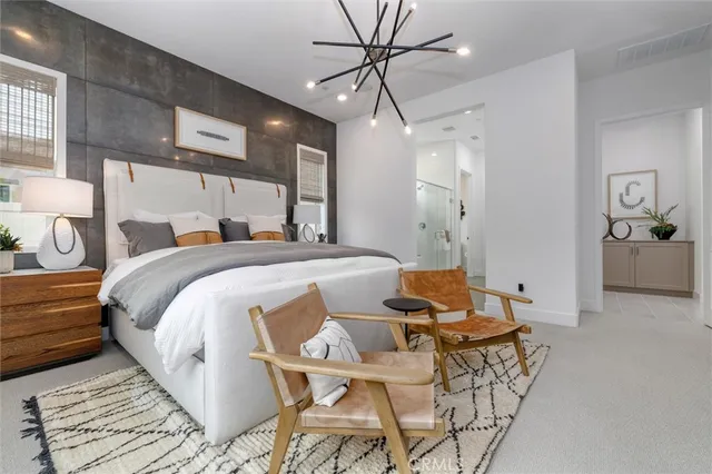 a bed room with a bed and a chair