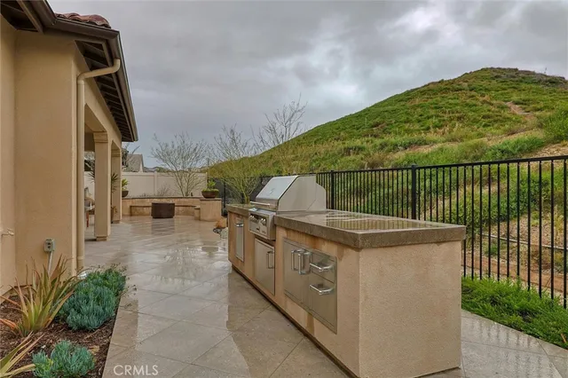 a view of a backyard with couches