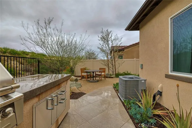 a view of a backyard with sitting area