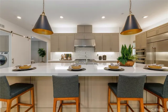 a kitchen with a sink cabinets and window