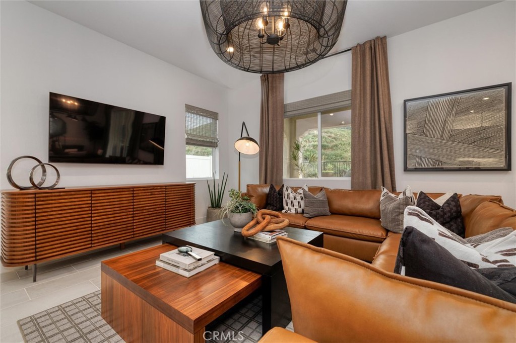 29606 Paseo Capilla Valencia, CA 91354 - Photo 6 of 26 a living room with furniture and a flat screen tv