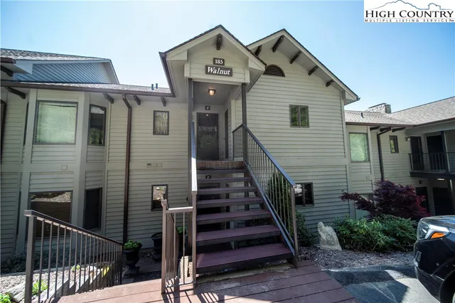 a front view of a house with wooden stairs