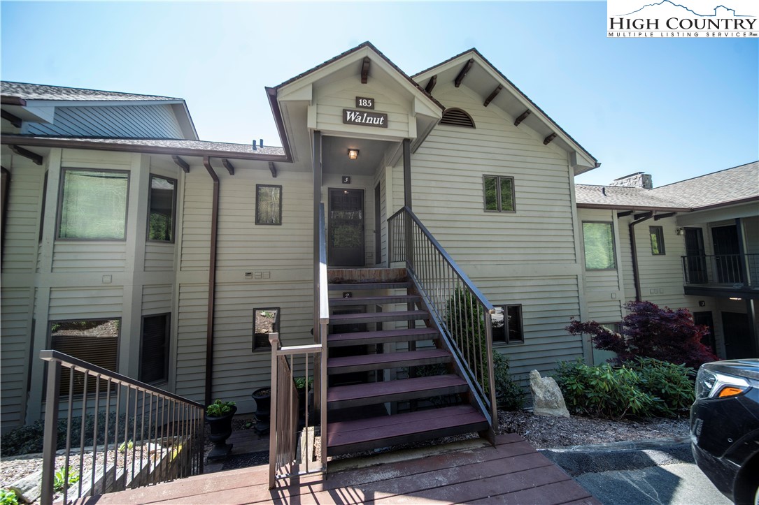 a front view of a house with wooden stairs