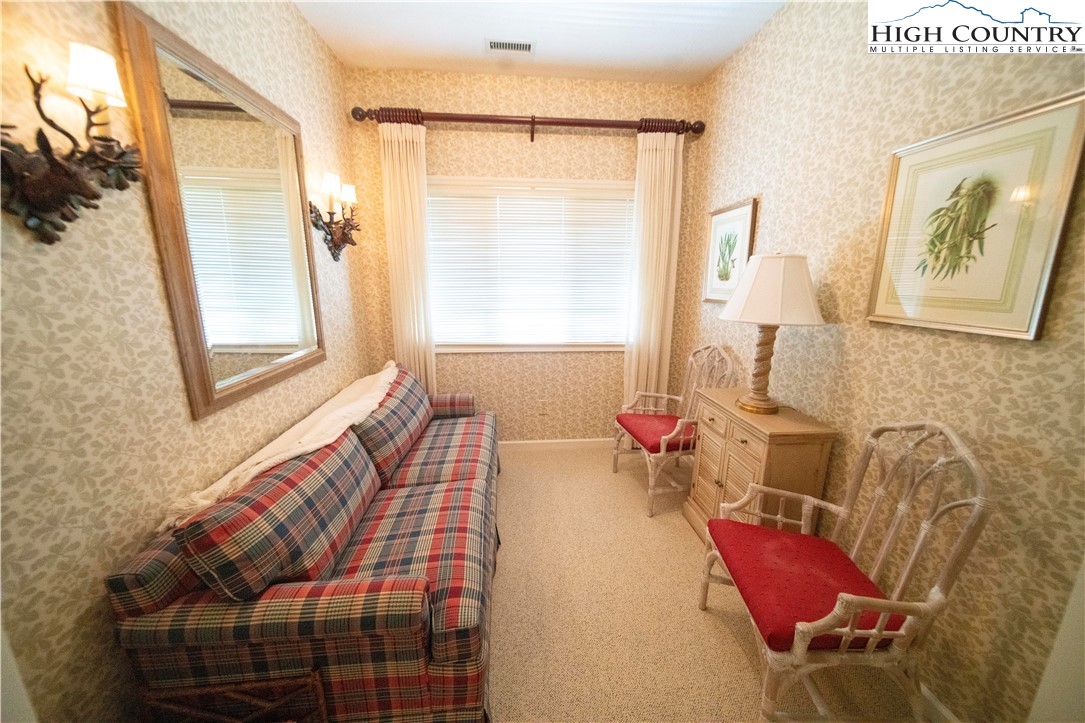 185 Waterside Drive, Unit 20 OF WALNUT 5 Blowing Rock, NC 28605 - Photo 6 of 15 a bedroom with a bed and wooden floor