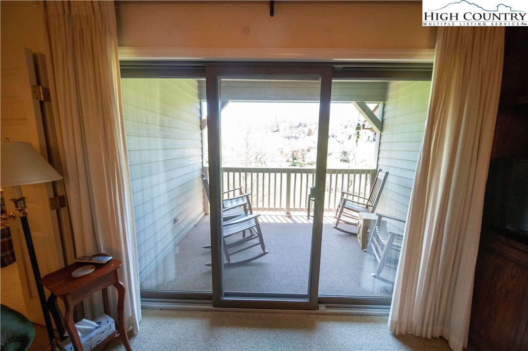 185 Waterside Drive, Unit 20 OF WALNUT 5 Blowing Rock, NC 28605 - Photo 7 of 15 a view of a room with wooden floor and windows