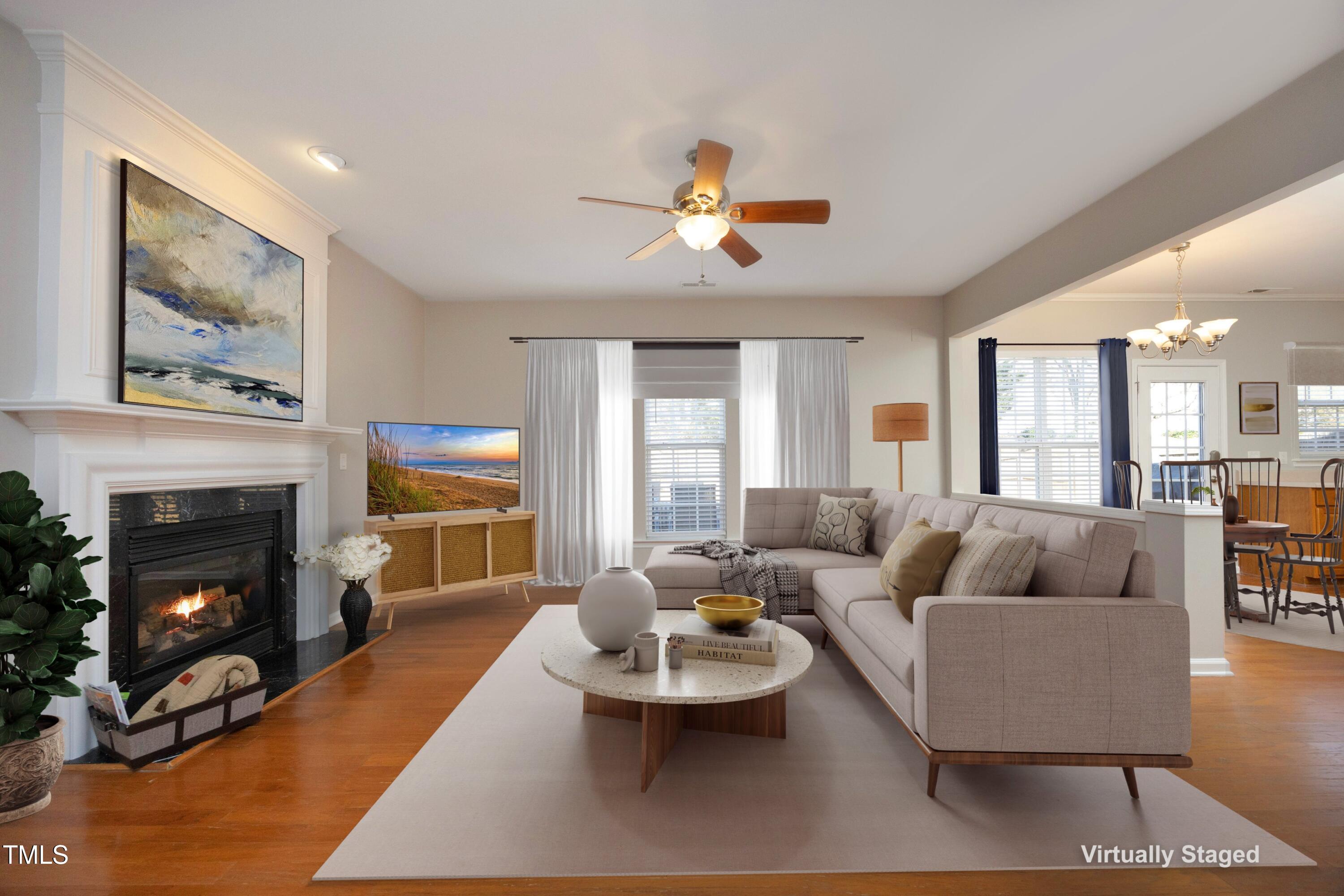 1525 Nealstone Way Raleigh, NC 27614 - Photo 11 of 47 a living room with furniture and a fireplace
