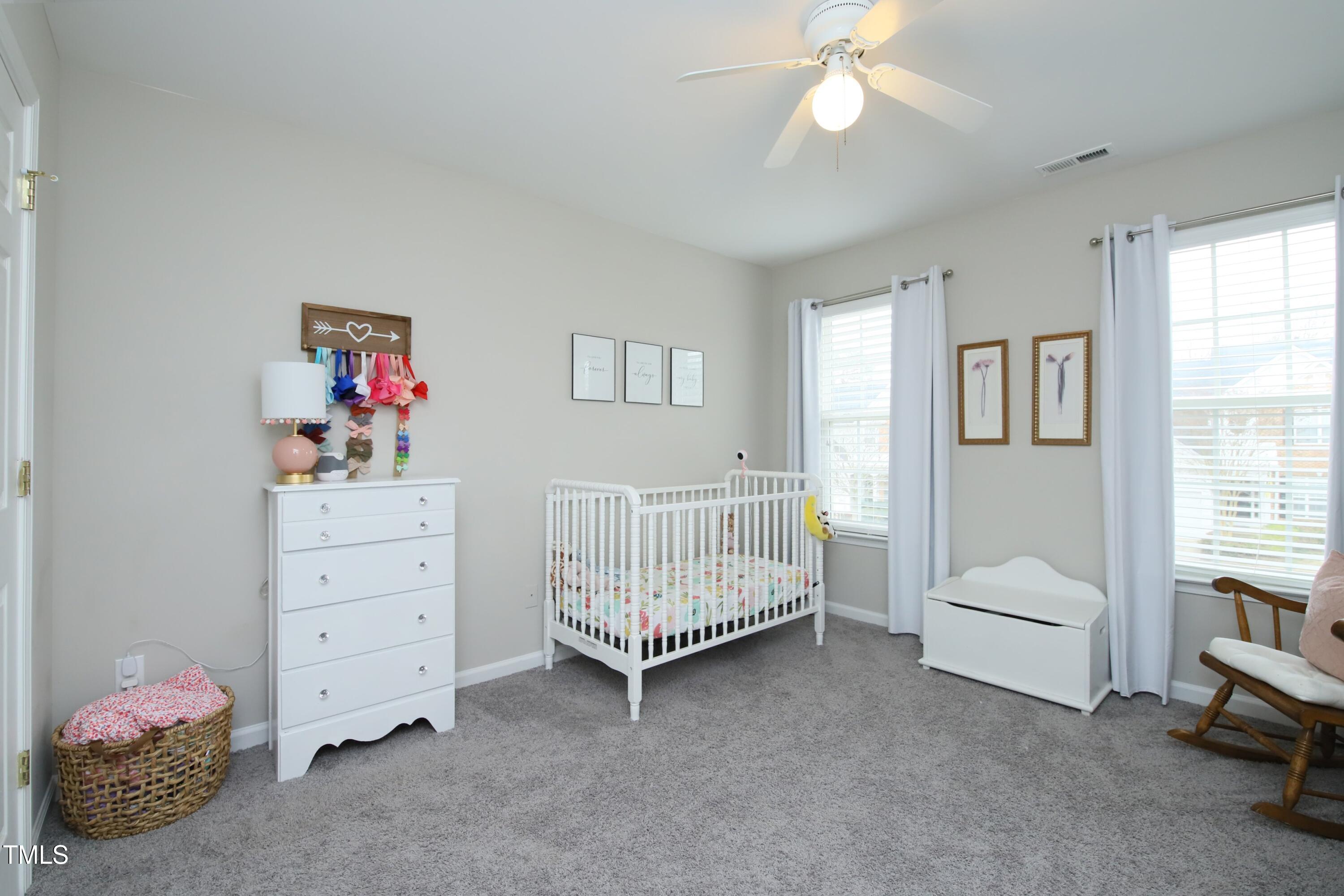 1525 Nealstone Way Raleigh, NC 27614 - Photo 30 of 47 a bedroom with furniture and a window