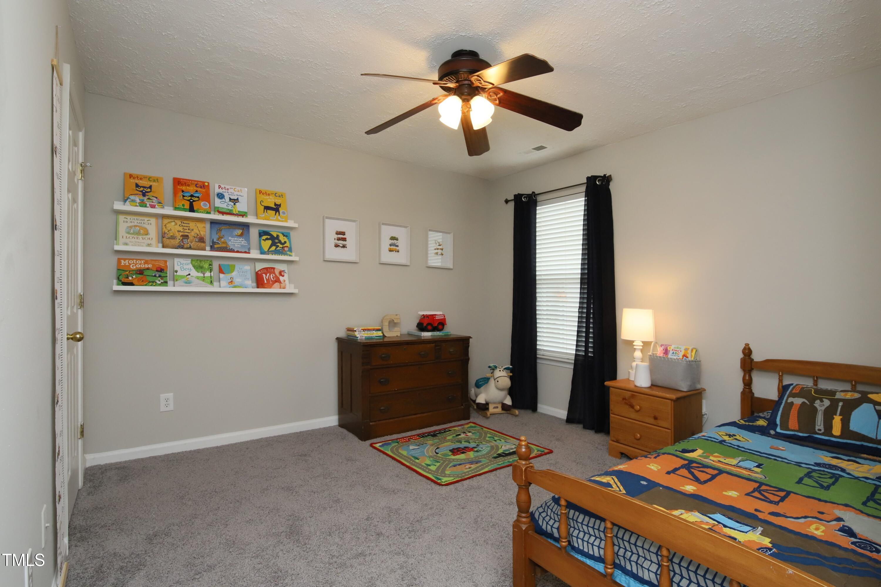 1525 Nealstone Way Raleigh, NC 27614 - Photo 32 of 47 a bedroom with furniture and a baby crib