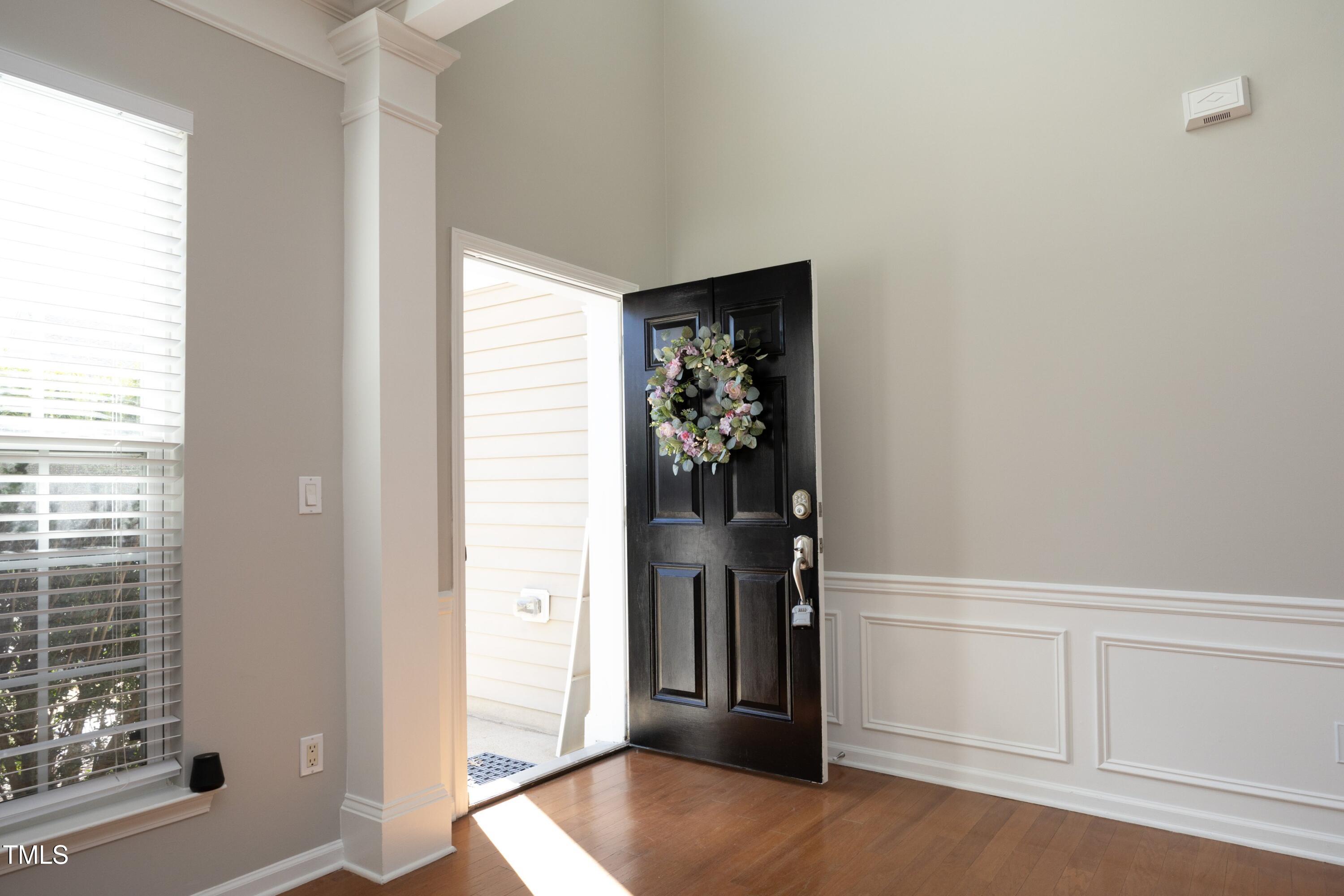 1525 Nealstone Way Raleigh, NC 27614 - Photo 4 of 47 a view of a hallway with wooden floor and closet