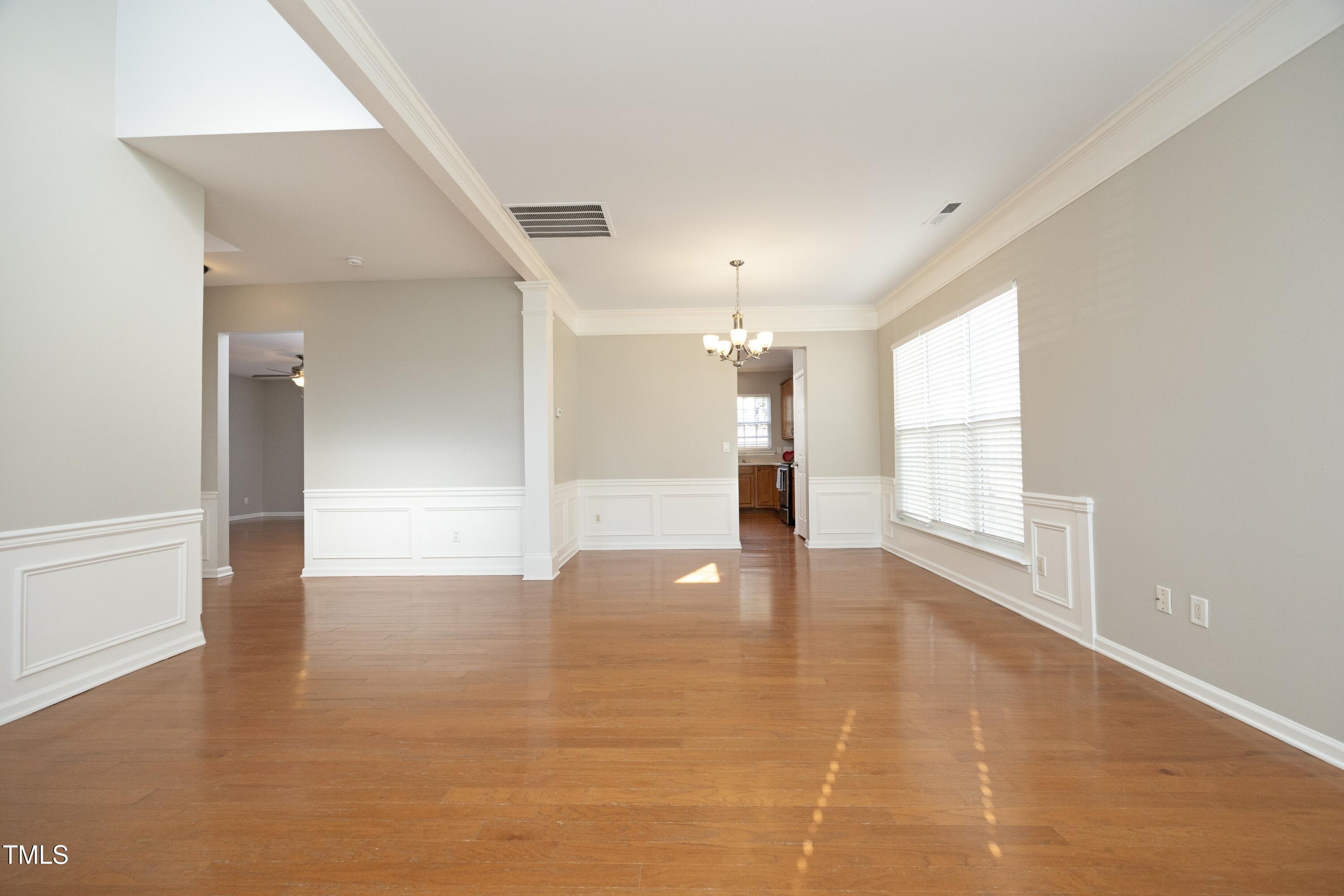 1525 Nealstone Way Raleigh, NC 27614 - Photo 6 of 47 wooden floor in an empty room with a window