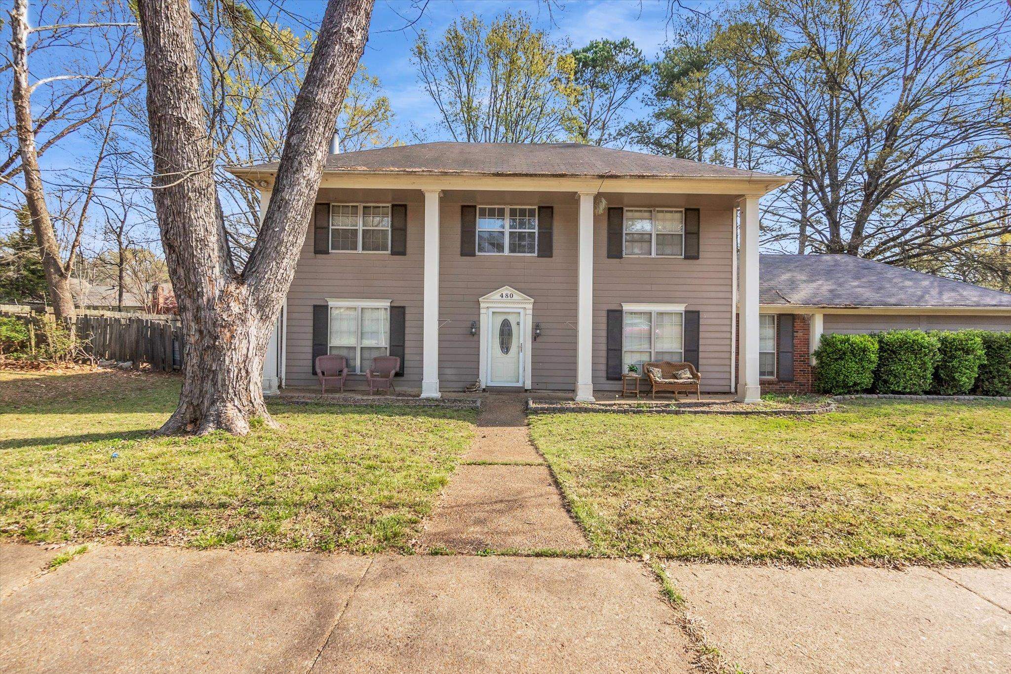 480 Friars Point Lane Memphis, TN 38018 - Photo 1 of 26 Greek revival inspired property with covered porch and roof with shingles