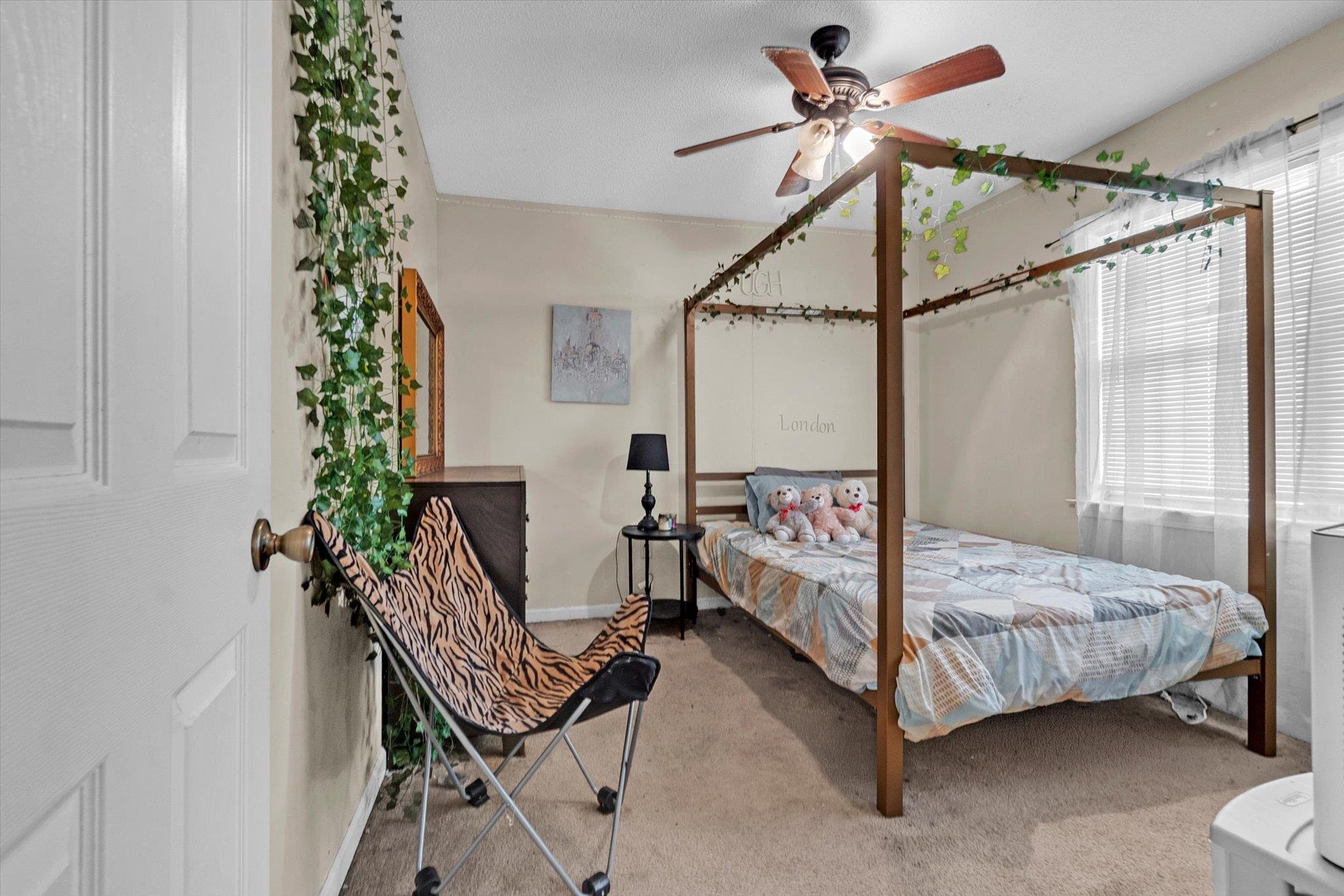 480 Friars Point Lane Memphis, TN 38018 - Photo 23 of 26 Bedroom with light colored carpet and ceiling fan