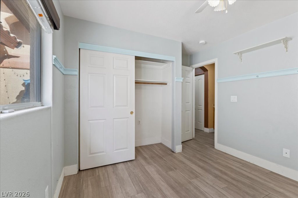 120 Ringlore Road Henderson, NV 89015 - Photo 42 of 58 Clean lines and durable wood-look flooring define this versatile secondary bedroom space.