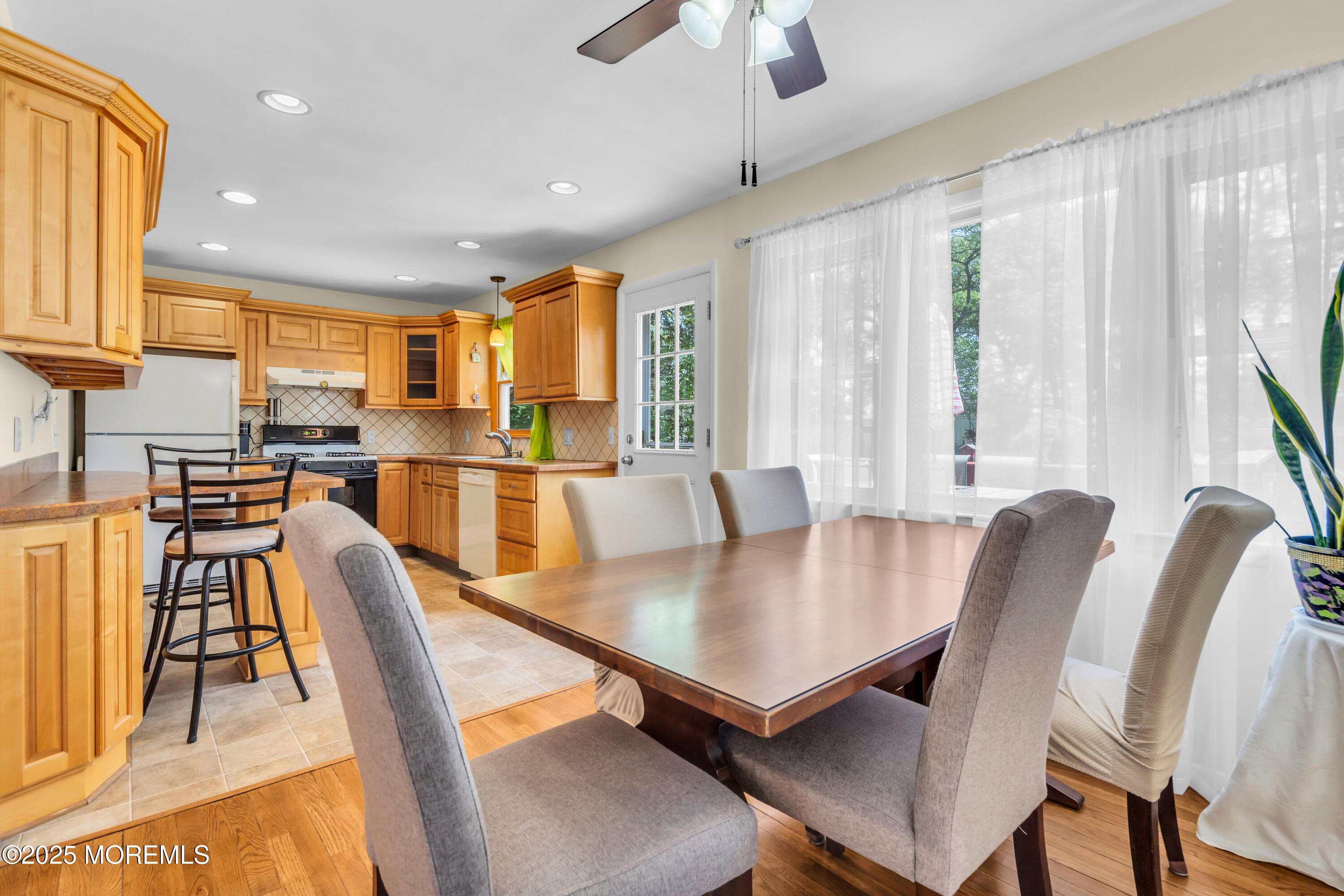 104 Frede Drive Brick, NJ 08724 - Photo 11 of 62 a view of a dining room with furniture and a large window