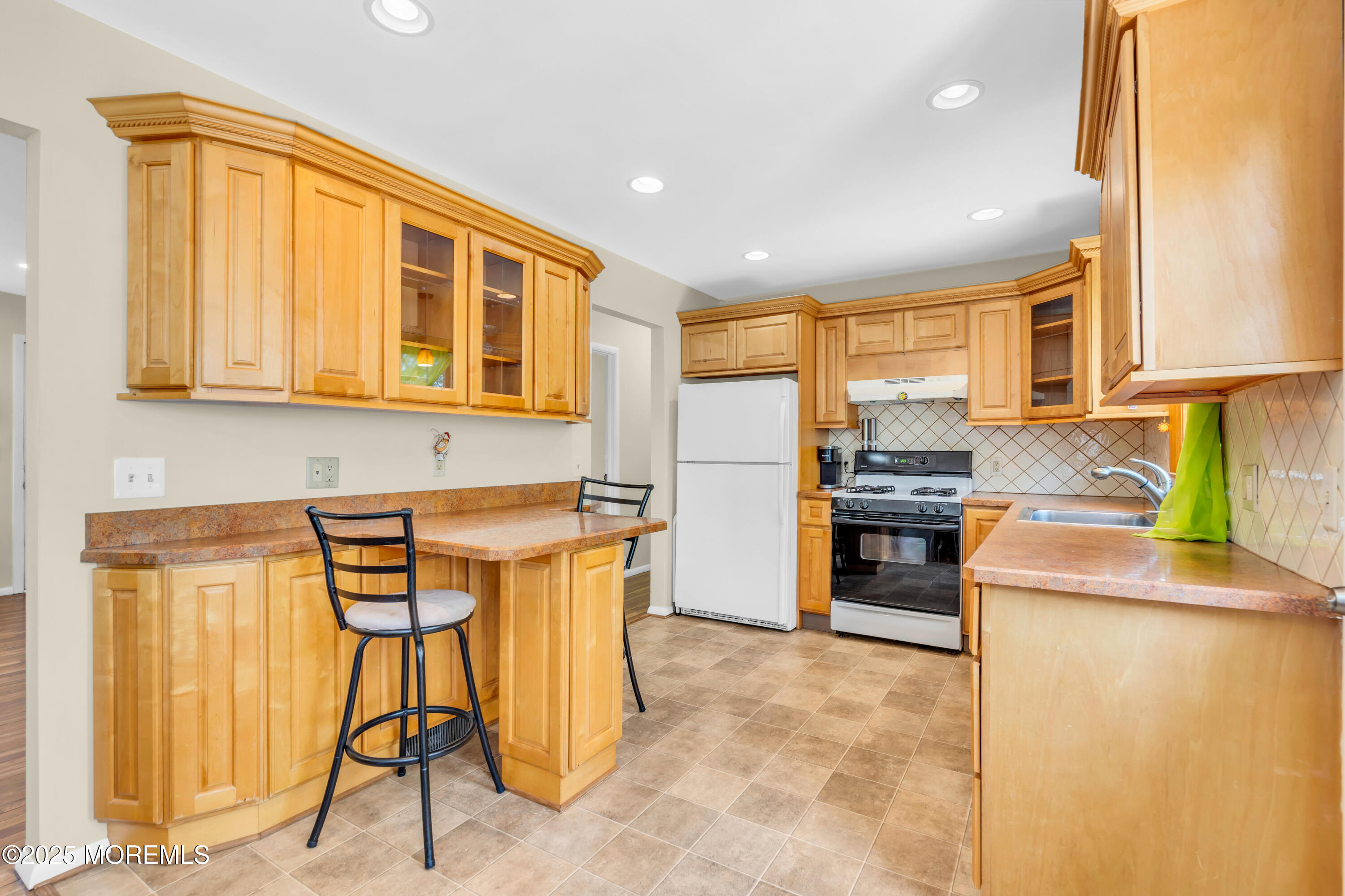 104 Frede Drive Brick, NJ 08724 - Photo 15 of 62 a kitchen that has a lot of cabinets in it and appliances