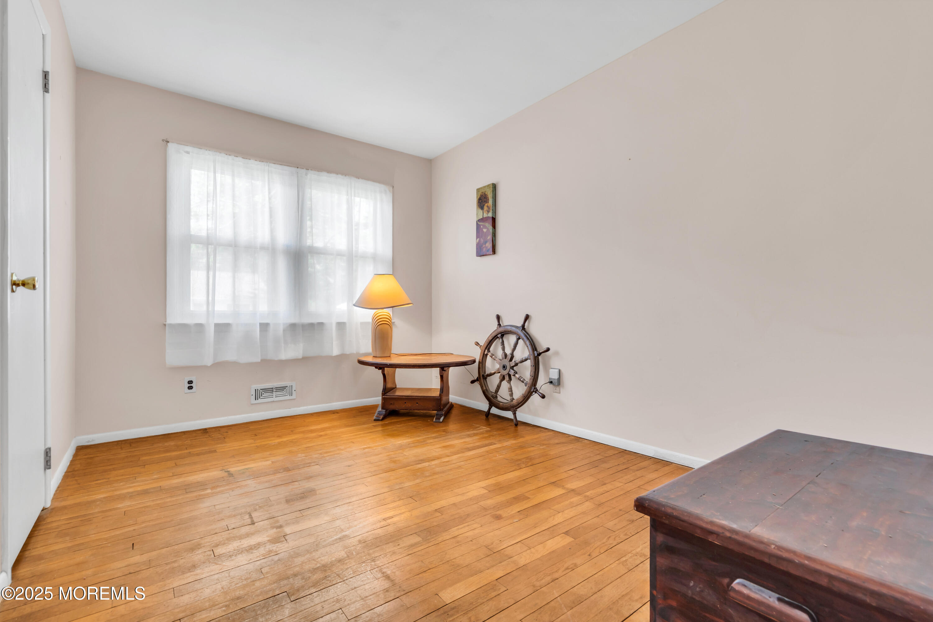 104 Frede Drive Brick, NJ 08724 - Photo 21 of 62 a view of a room with wooden floor and a window