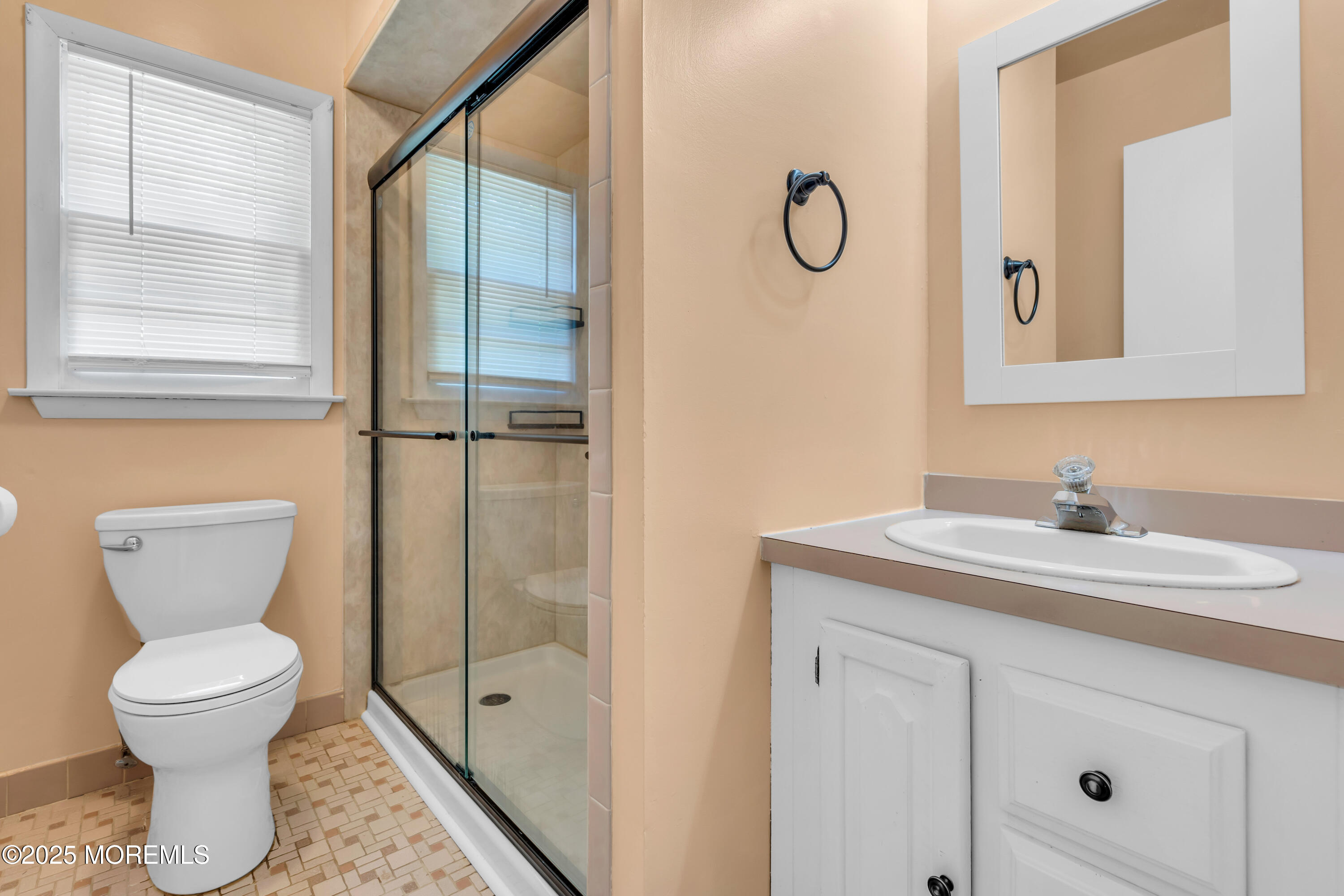 104 Frede Drive Brick, NJ 08724 - Photo 22 of 62 a bathroom with a toilet sink and mirror