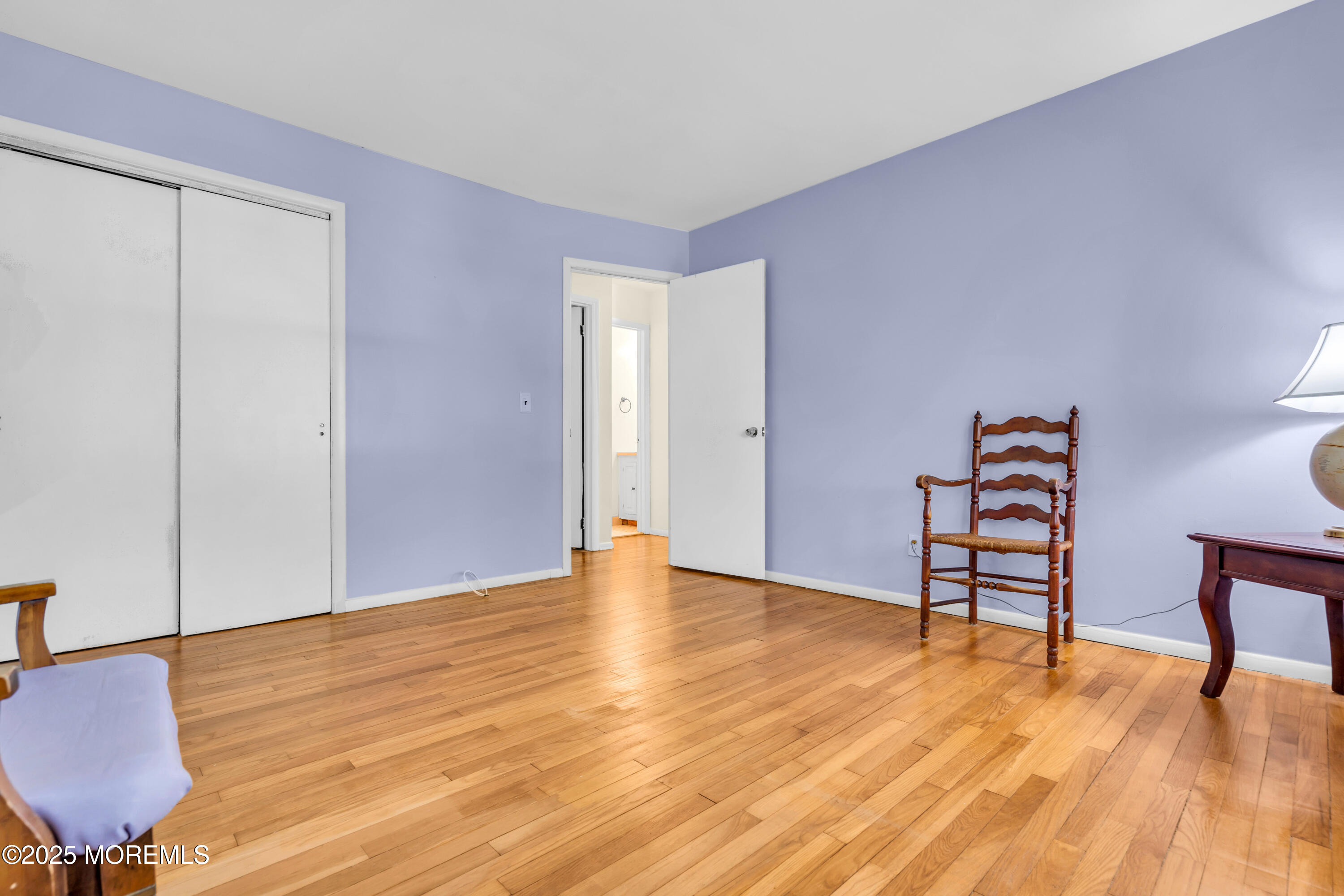 104 Frede Drive Brick, NJ 08724 - Photo 24 of 62 a view of an empty room with window and wooden floor