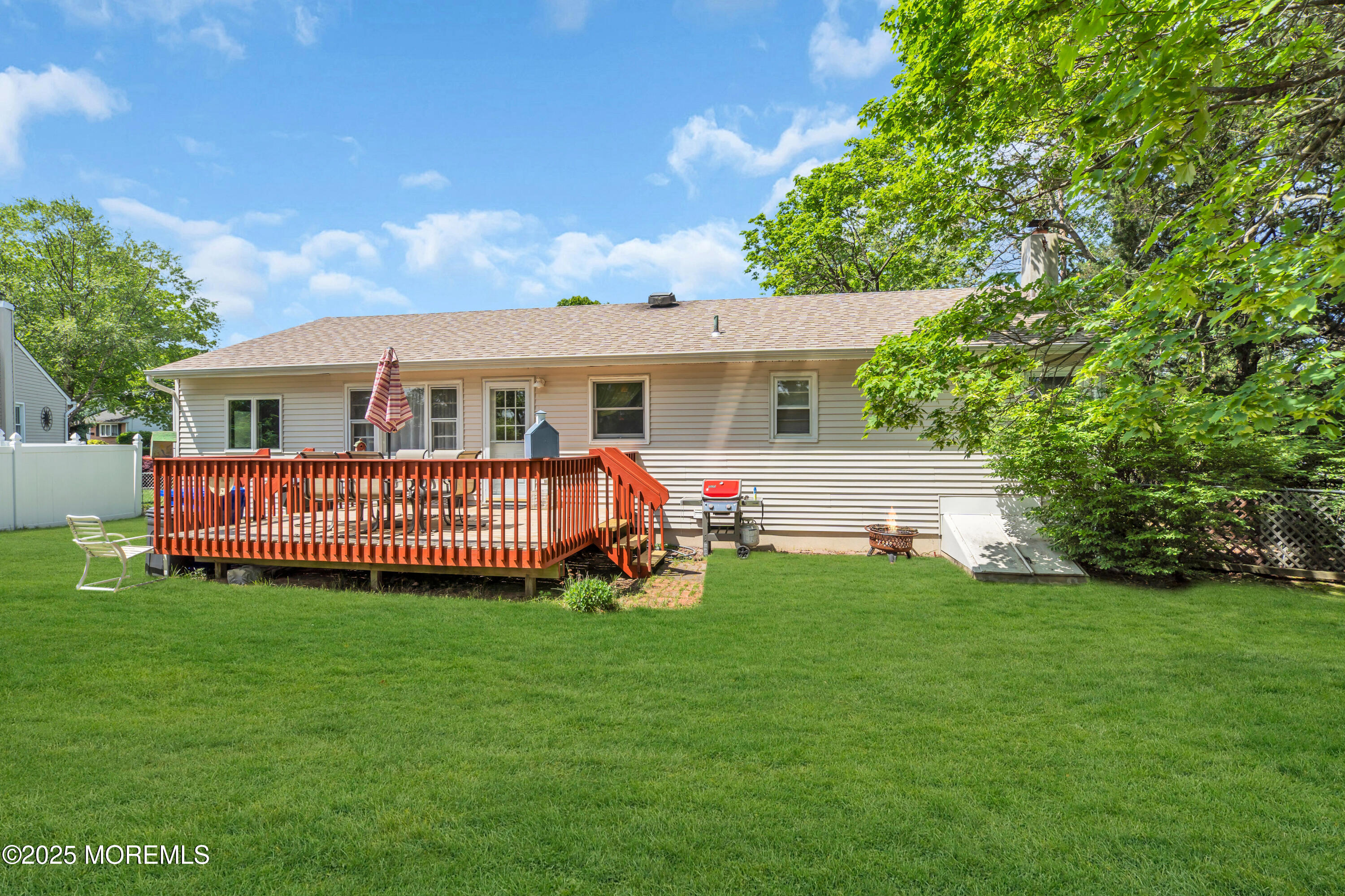 104 Frede Drive Brick, NJ 08724 - Photo 35 of 62 a view of a house with a yard and sitting area