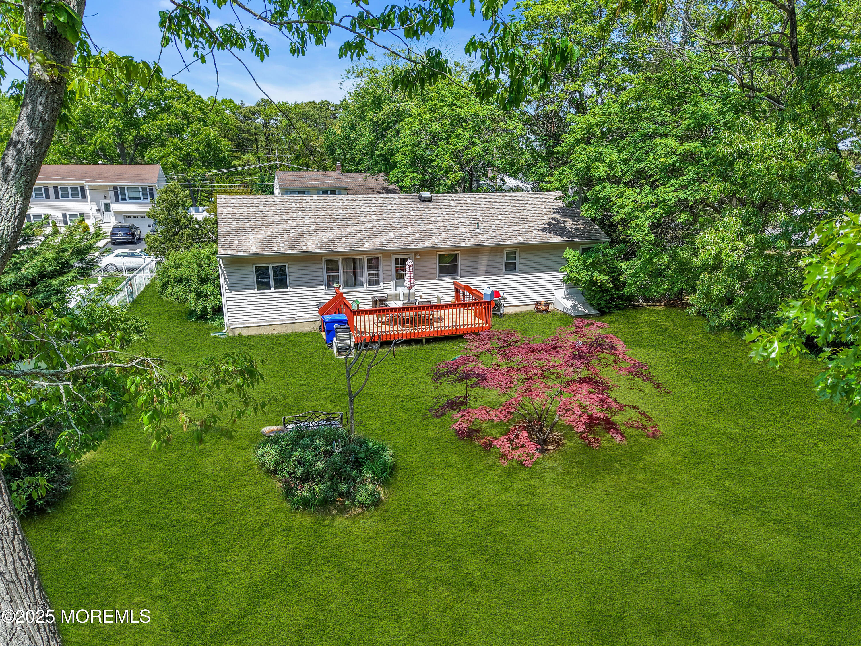104 Frede Drive Brick, NJ 08724 - Photo 41 of 62 a front view of a house with a garden and deck