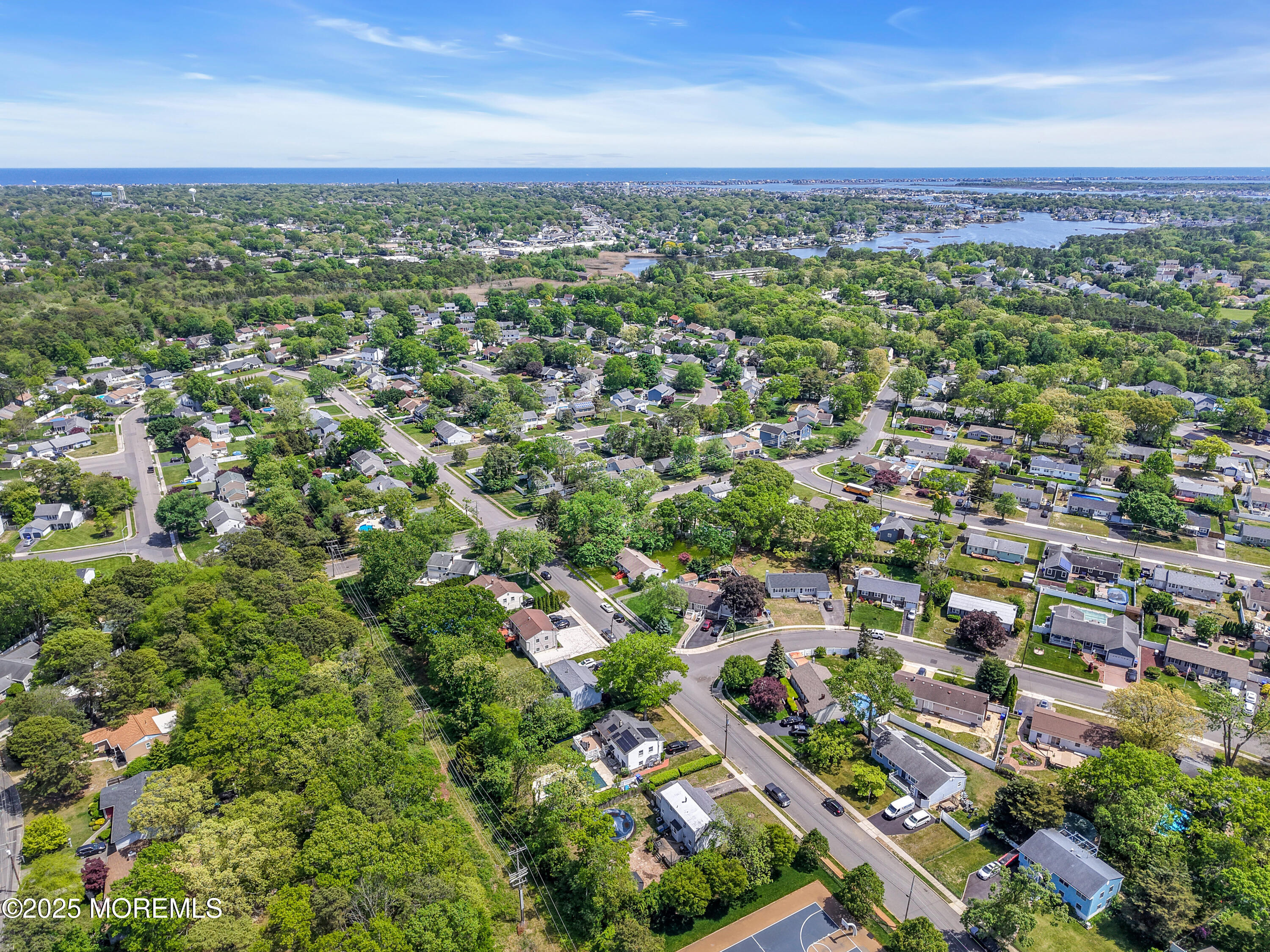 104 Frede Drive Brick, NJ 08724 - Photo 49 of 62 an aerial view of residential houses with outdoor space and trees