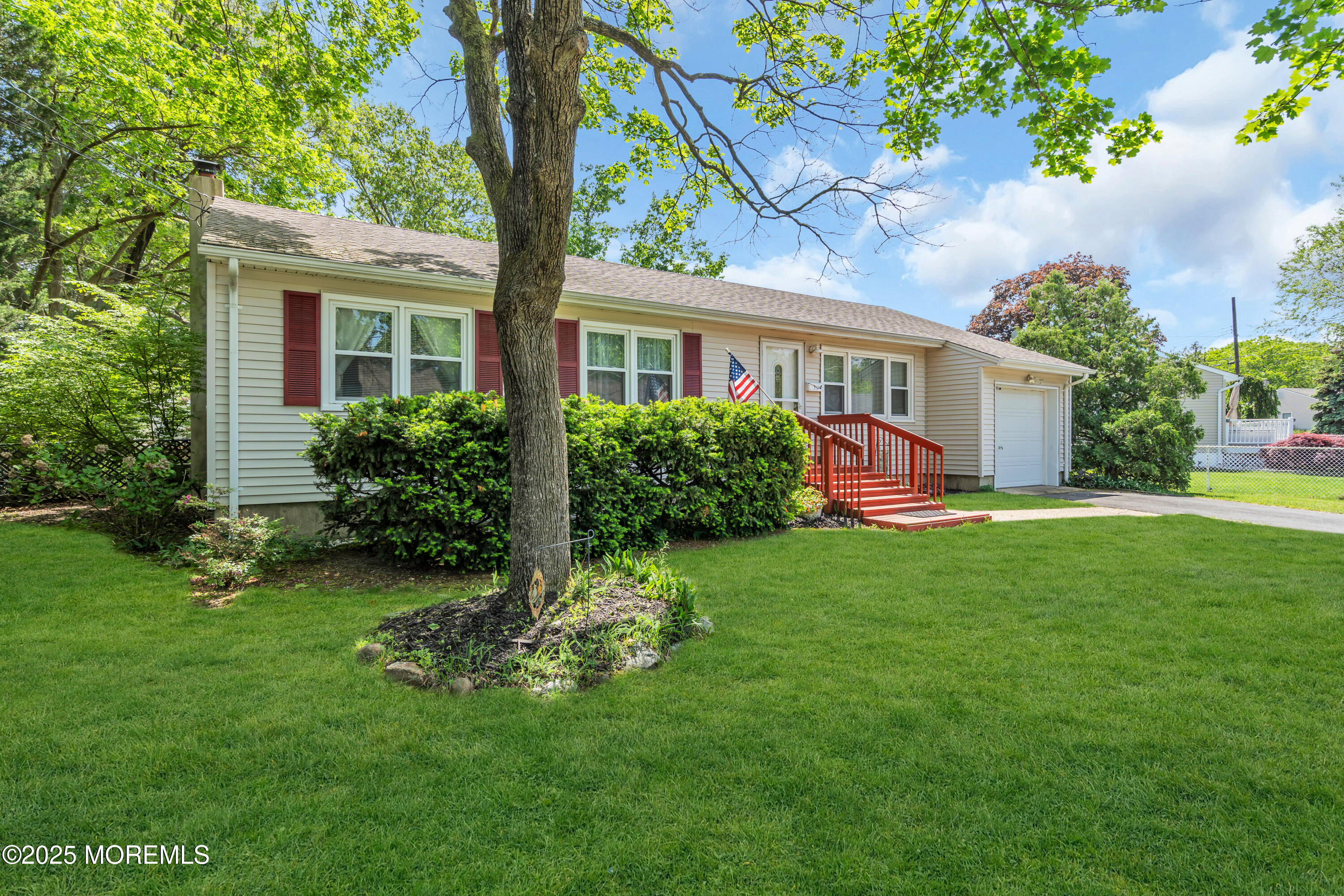 104 Frede Drive Brick, NJ 08724 - Photo 5 of 62 a front view of a house with a yard and porch