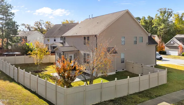a view of a house with outdoor seating area