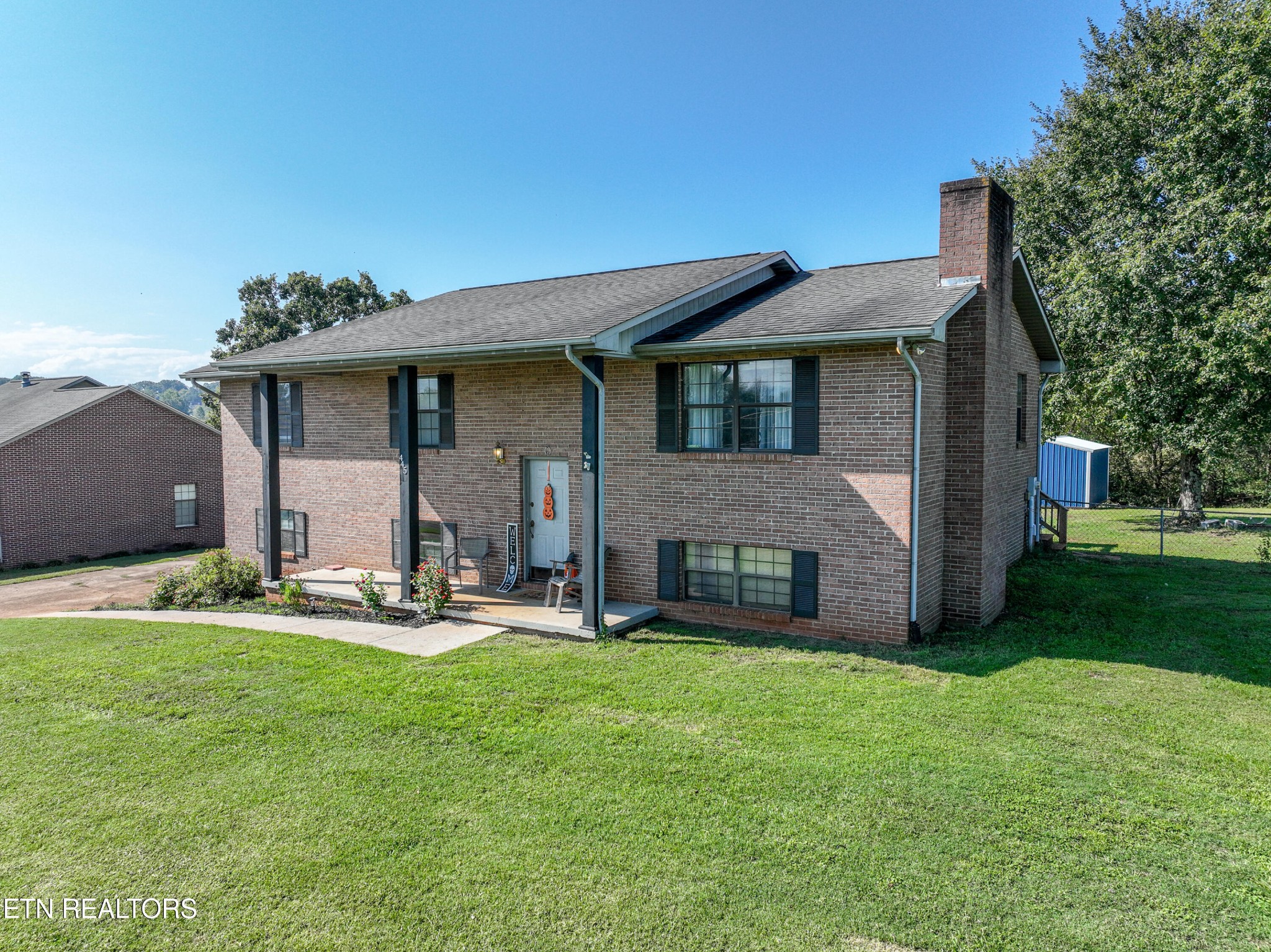445 Foss Road Maryville, TN 37801 - Photo 1 of 40 a front view of a house with patio and garden