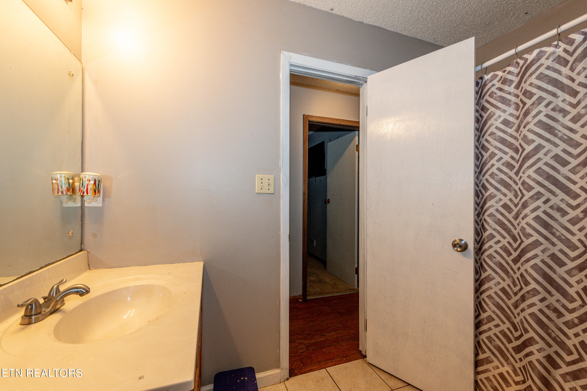 445 Foss Road Maryville, TN 37801 - Photo 17 of 40 a bathroom with a tub and shower