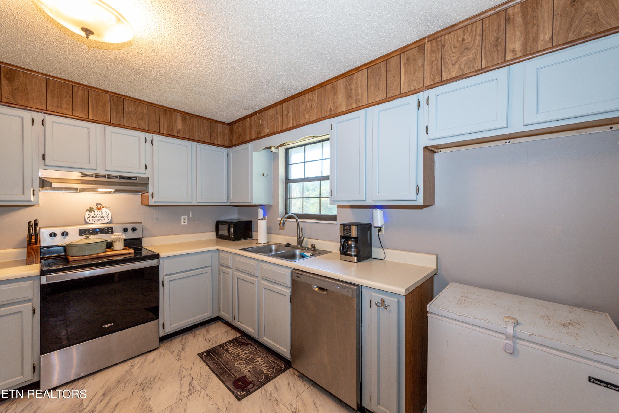 445 Foss Road Maryville, TN 37801 - Photo 8 of 40 a kitchen with a sink cabinets and window