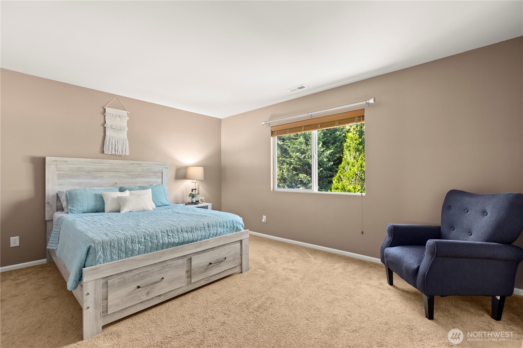 24002 Southeast 262nd Street Maple Valley, WA 98038 - Photo 15 of 30 a bedroom with a bed couch and window