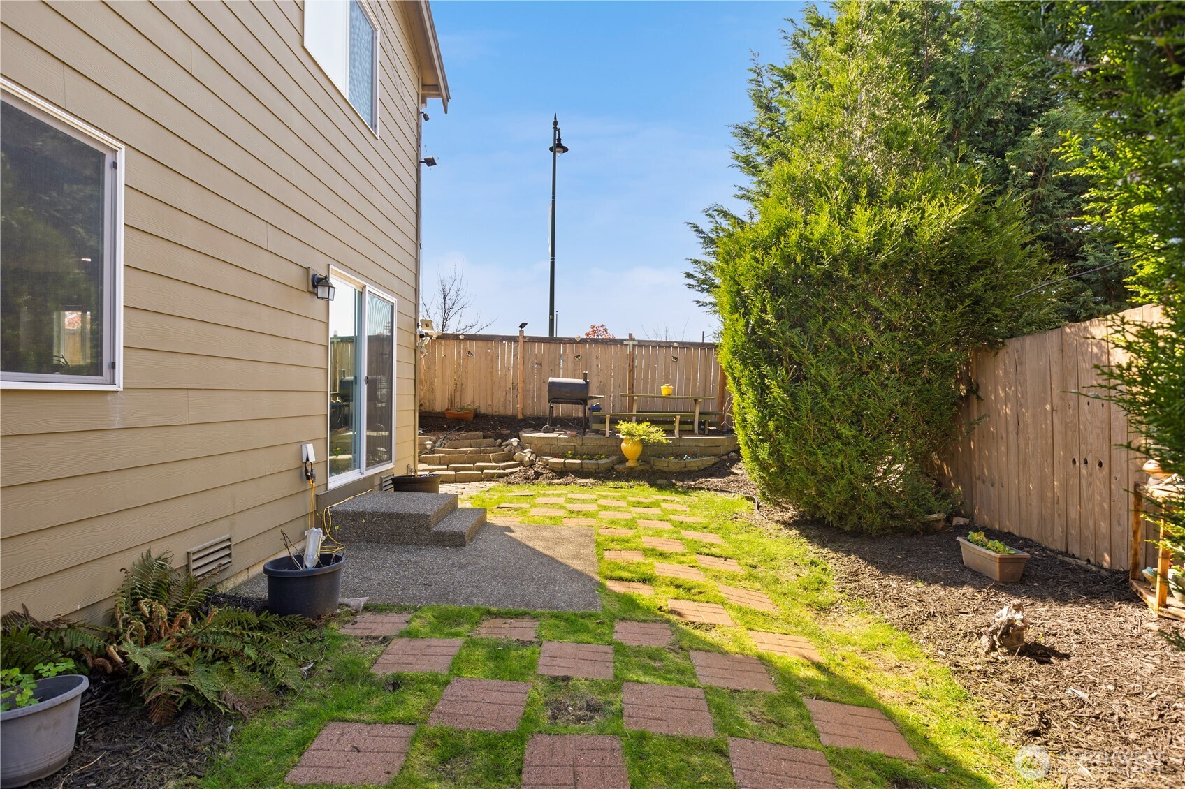 24002 Southeast 262nd Street Maple Valley, WA 98038 - Photo 26 of 30 a view of a backyard with sitting area