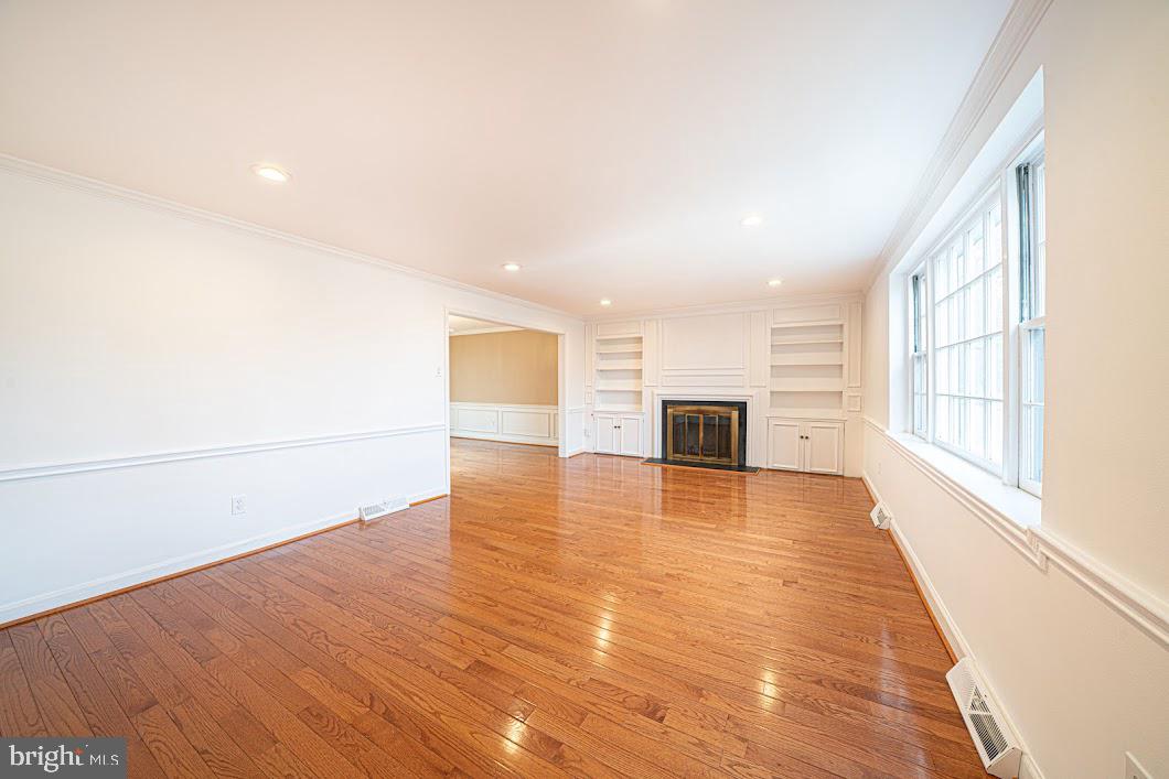 642 Pugh Road Wayne, PA 19087 - Photo 2 of 65 a view of a livingroom with wooden floor and a kitchen