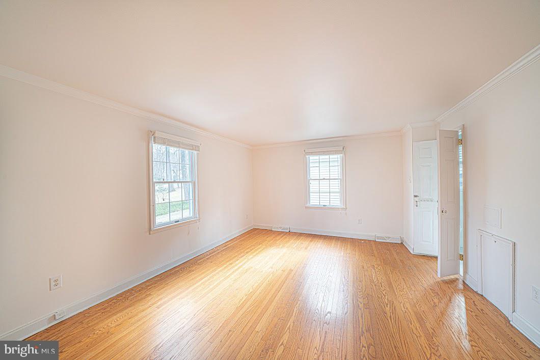 642 Pugh Road Wayne, PA 19087 - Photo 27 of 65 an empty room with wooden floor and windows