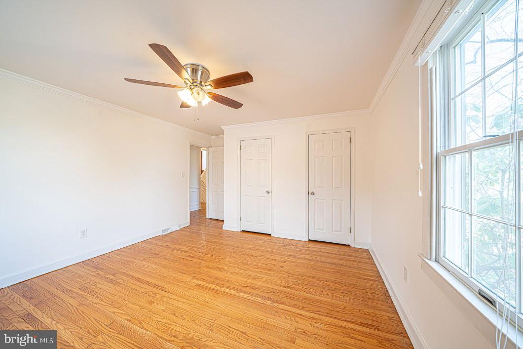 642 Pugh Road Wayne, PA 19087 - Photo 30 of 65 a view of a big room with wooden floor and a chandelier fan
