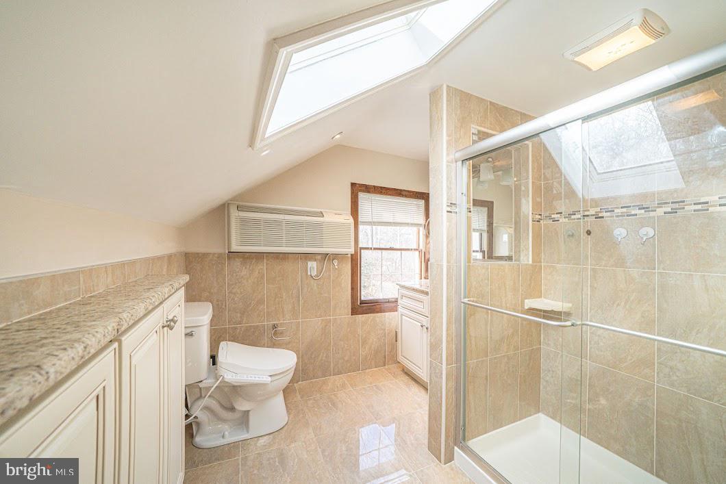 642 Pugh Road Wayne, PA 19087 - Photo 41 of 65 a bathroom with a granite countertop sink a toilet and shower