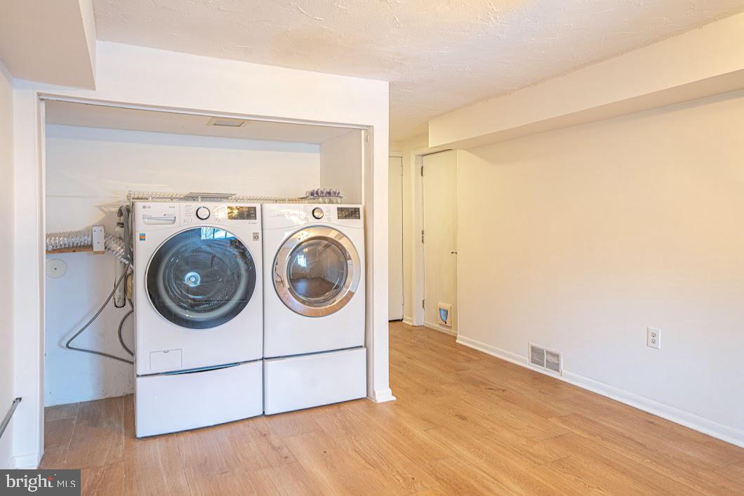 642 Pugh Road Wayne, PA 19087 - Photo 42 of 65 a utility room with dryer and washer