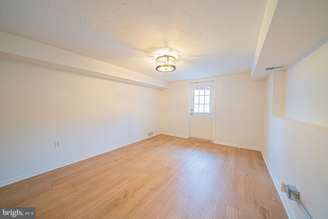 642 Pugh Road Wayne, PA 19087 - Photo 44 of 65 wooden floor in an empty room with a window