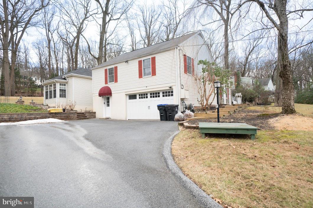 642 Pugh Road Wayne, PA 19087 - Photo 49 of 65 a view of a house with snow on the road