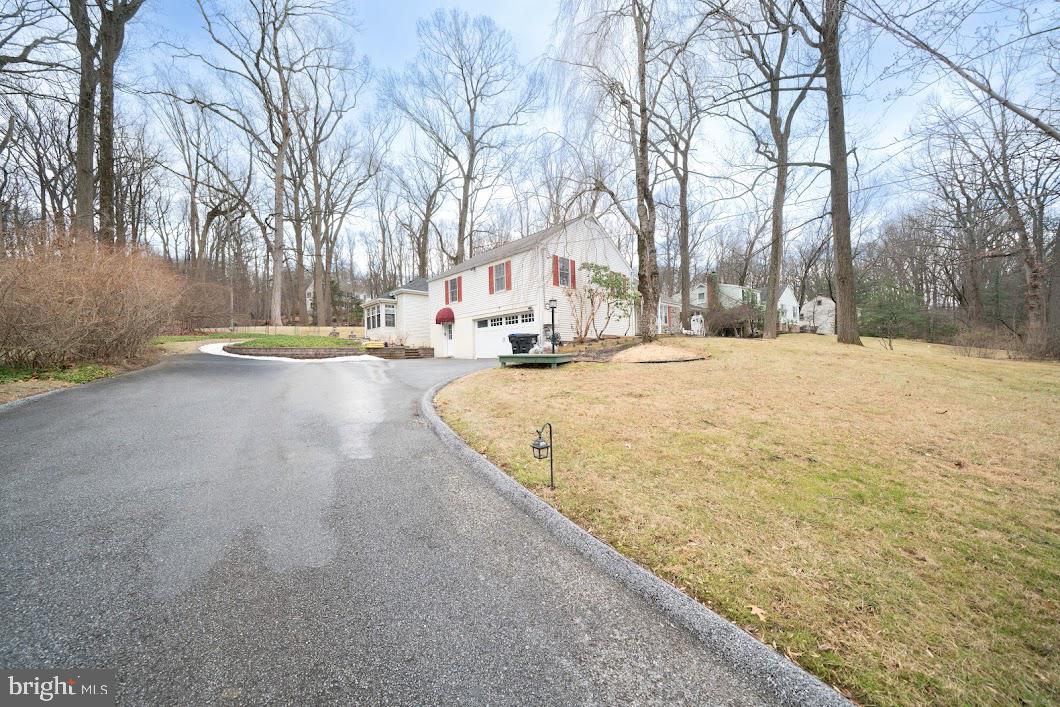 642 Pugh Road Wayne, PA 19087 - Photo 50 of 65 a view of a yard with snow on the road