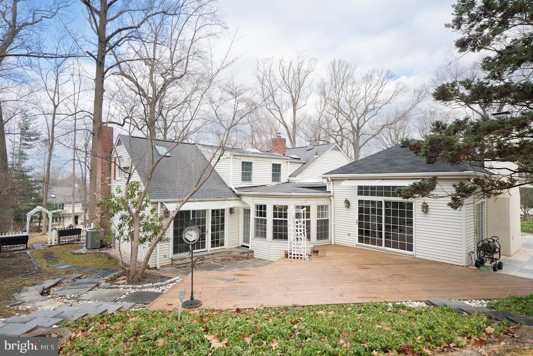 642 Pugh Road Wayne, PA 19087 - Photo 56 of 65 front view of a house with a yard and potted plants
