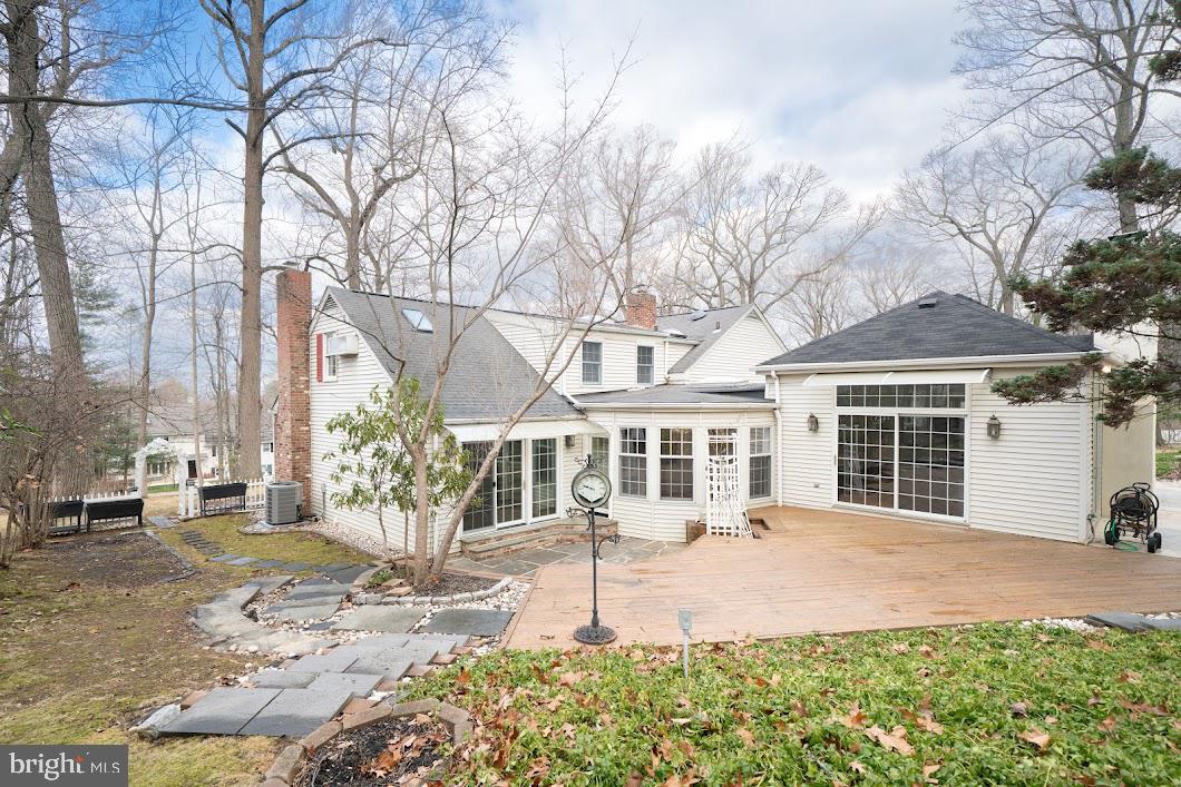 642 Pugh Road Wayne, PA 19087 - Photo 58 of 65 a front view of a house with a yard and potted plants