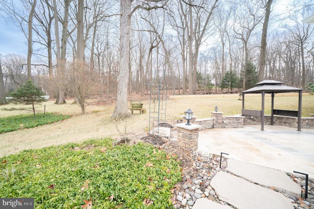 642 Pugh Road Wayne, PA 19087 - Photo 63 of 65 a view of a swimming pool with a patio and a yard
