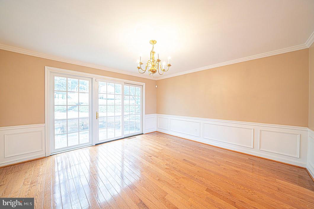 642 Pugh Road Wayne, PA 19087 - Photo 8 of 65 a view of an empty room with wooden floor and a window