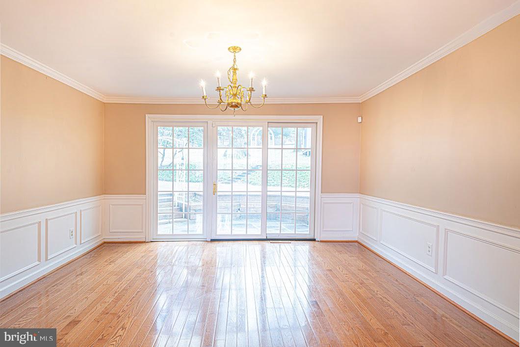 642 Pugh Road Wayne, PA 19087 - Photo 9 of 65 a view of an empty room with a window and wooden floor