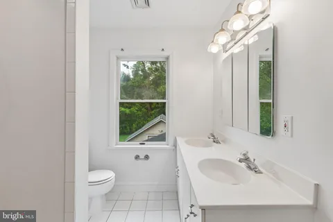 a view of an empty room and closet area