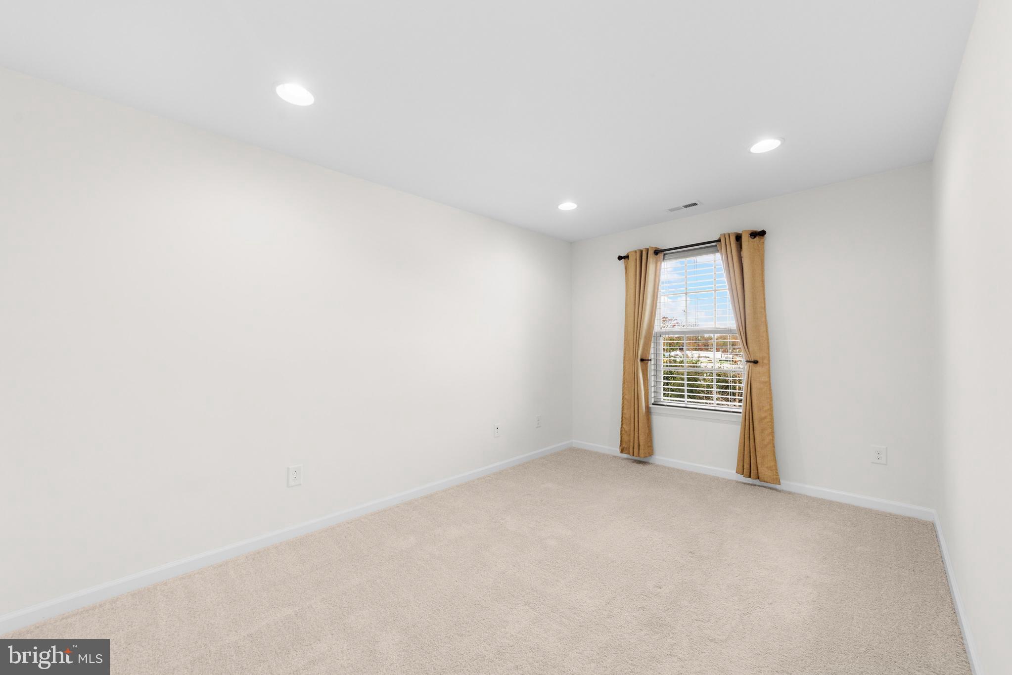 42 Sundance Drive Hamilton, NJ 08619 - Photo 15 of 25 a view of an empty room with a window