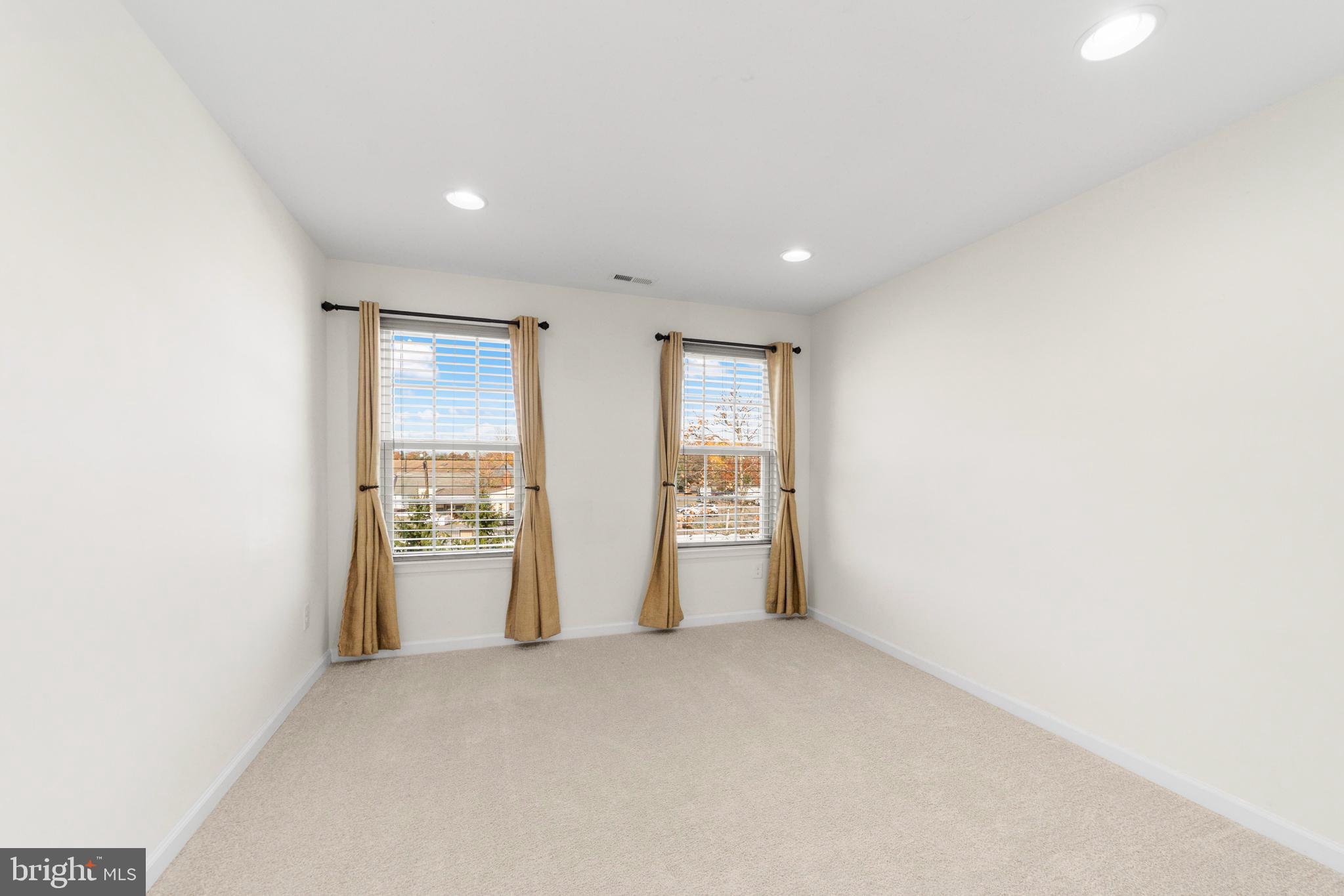 42 Sundance Drive Hamilton, NJ 08619 - Photo 16 of 25 a view of an empty room with a window