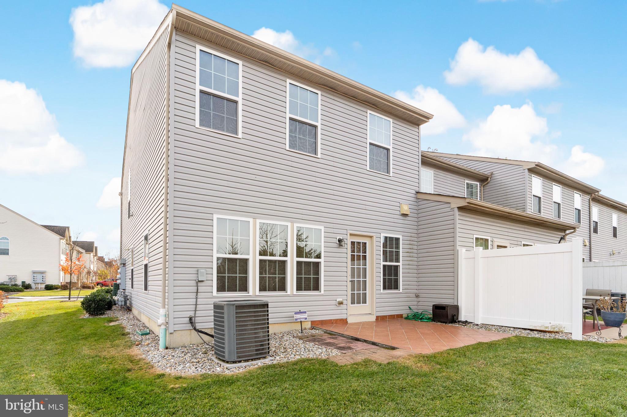 42 Sundance Drive Hamilton, NJ 08619 - Photo 3 of 25 a backyard of a house with garden and barbeque oven