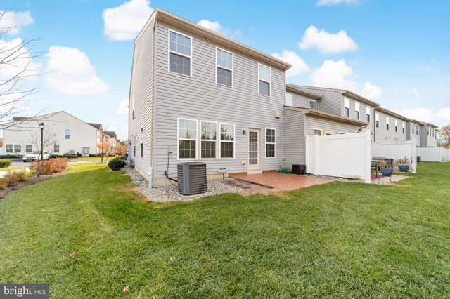 a view of a house with a yard and garage